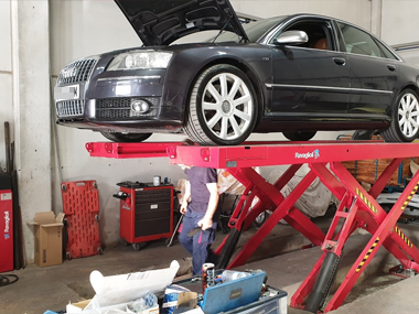 Audi S8 on ramp in workshop